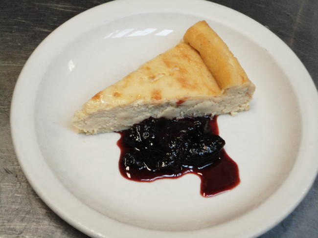 Toureau poitevin:  rich ricotta cake with spiced red wine and cognac poached prunes.