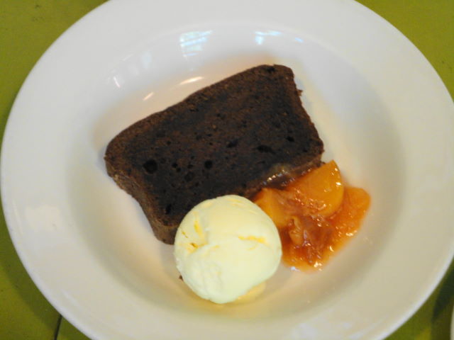 Cocoa-almond pound cake with stone fruit compote and almond ice cream.