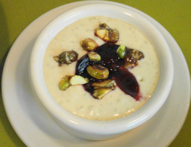 Pistachio rice pudding with bing cherry confiture and candied pistachios.