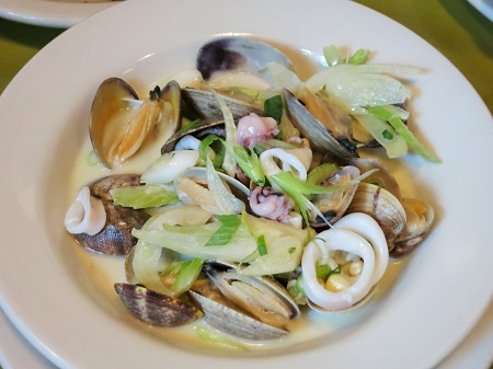 Penn Cove clams and Monterrey calimari sauteed with pastis, sweet corn, creme fraiche, fennel, green onion and celery