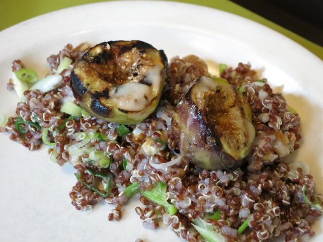 Accompanying our cold half roasted chicken, a salad of red quinoa, walnuts, green onions, grilled figs and champagne vinaigrette