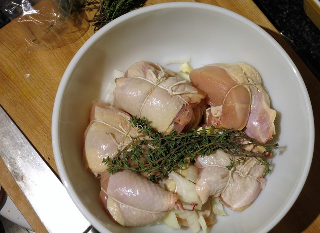 The chicken is cut up and tied, then marinated overnight with vin jaune.