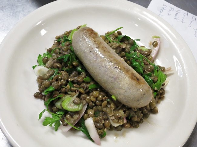 Grilled rabbit-pork boudin, on a warm salad of French lentils, shallots, spring onions parsley and mustard vinaigrette.