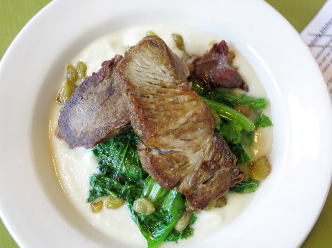Crispy port shoulder and tongue with cauliflower puree, sauteed mustard greens and sultanas.