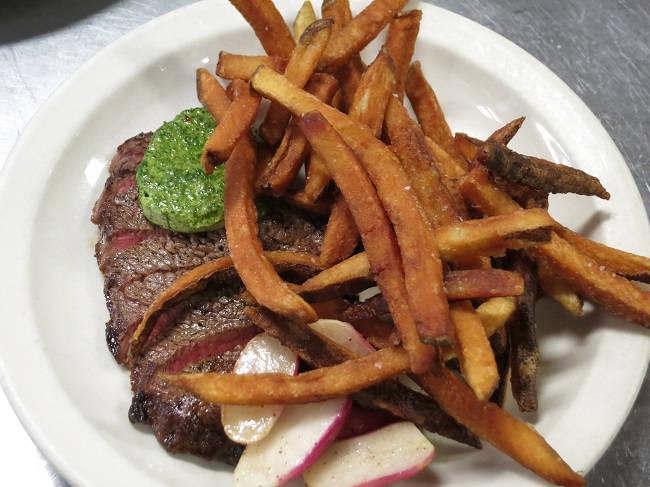 Grass-fed petit sirloin steak, sauteed radishes, nettle pistou butter and pommes frites.