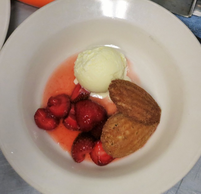 Warm pistachio madeleines, wildflower honey macerated strawberries, orange-bay leaf ice cream.