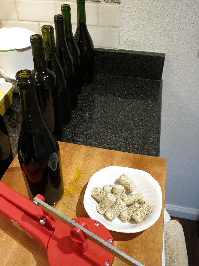 The vin de noix is put in clean bottles and corked.