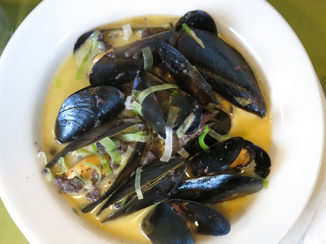 Penn Cove mussels sauteed with leeks, cider, thyme, house-made blood sausage and creme fraiche