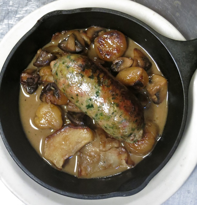 Pork-white chard sausage roasted in a skillet with chestnuts, mushrooms, sunchokes and hazelnut butter