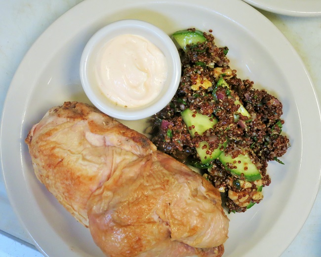 Cold roasted half chicken with tabbouleh made with red quinoa, parsley, mint, cilantro, walnuts, cucumber, dates and ras al hanout vinaigrette