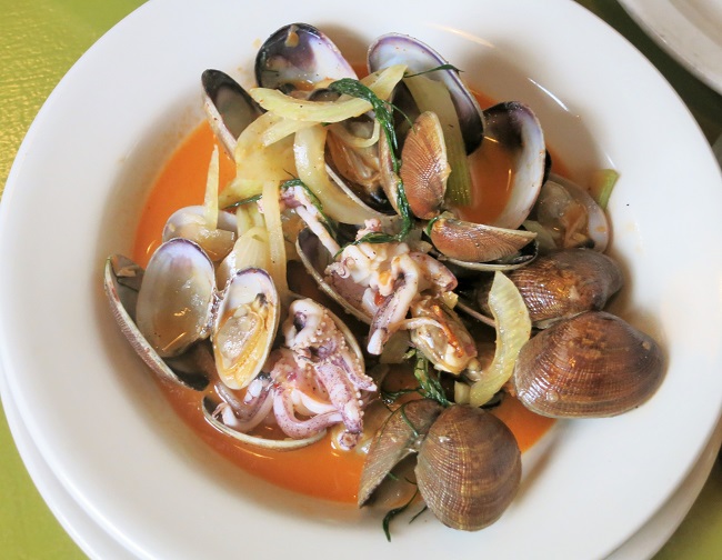 Penn Cove clams and calamari sauteed with fennel, sweet onion, olive oil, white wine and finished with harissa butter