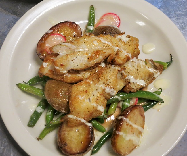 Washington coast rockfish, pan roasted and served with a warm salad of green beans, hazelnuts, radishes, preserved lemon vinaigette and duck fat fried potatoes