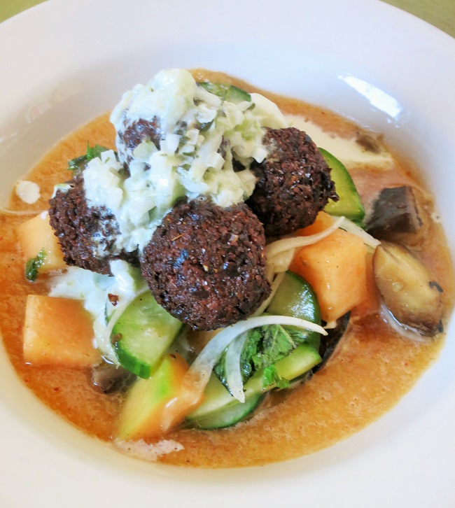 Crispy falafels with spicy melon puree, cucumber, grilled eggplant, mint, Walla Walla onions and sauce blanche