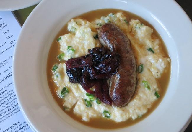 Toulouse style sausage served on creamy polenta with green onions and goat's milk cheese, rich pork jus and Bing cherry-sweet onion compote 