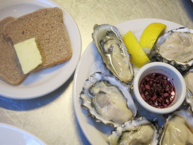 Local oysters on that half shell "a la Breton" with lemon, sauce mignonette, house rye bread and Breton sea salt butter.