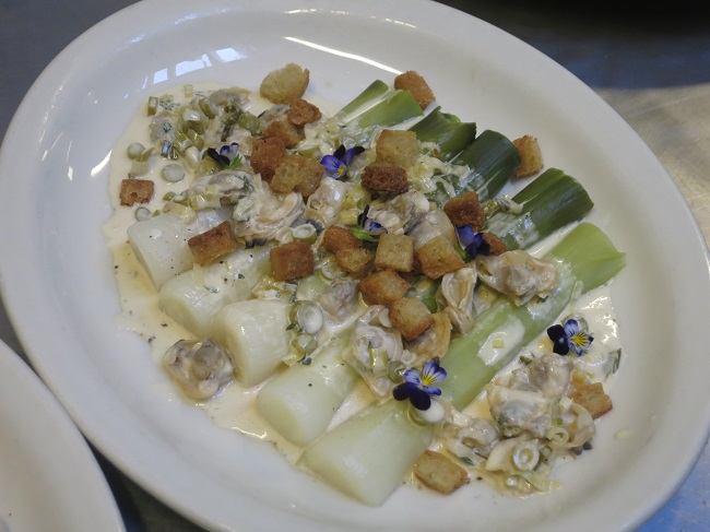 Leeks vinaigrette:  cold poached leeks served with Penn Cove clams marinated with thyme and green garlic, shellfish vinagrette and butter fried croutons 