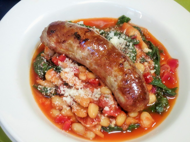 Pan roasted lamb-pork sausage served on a Corsican stye ragout of white beans, panchette, tomatoes, green chard and parmesan 