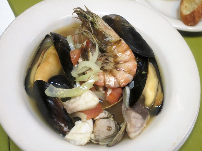 Seteoise fish soup with mussels, clams, prawns and white fish simmered in a saffron broth with tomato and fennel, served with rouille and croutons