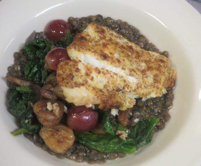 Alaskan ling cod filet baked with grain mustard, served on red wine lentil ragout and a saute of chard, chestnuts and red grapes
