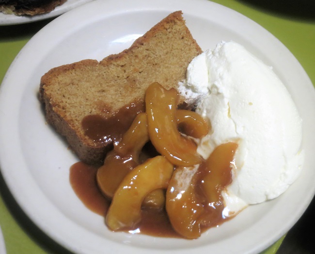 Warm spice-ginger cake served with caramelized apples and whipped cream